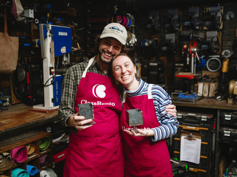 Couple showing off their DIY metal planter box